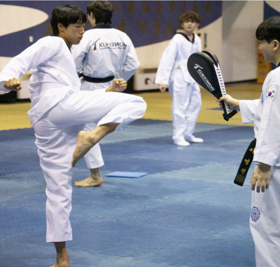 MAXWELL TING '28 PRACTICES Taekwondo kicks at Kukkiwon